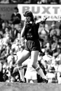 Julia Lee officiating during her refereeing days.